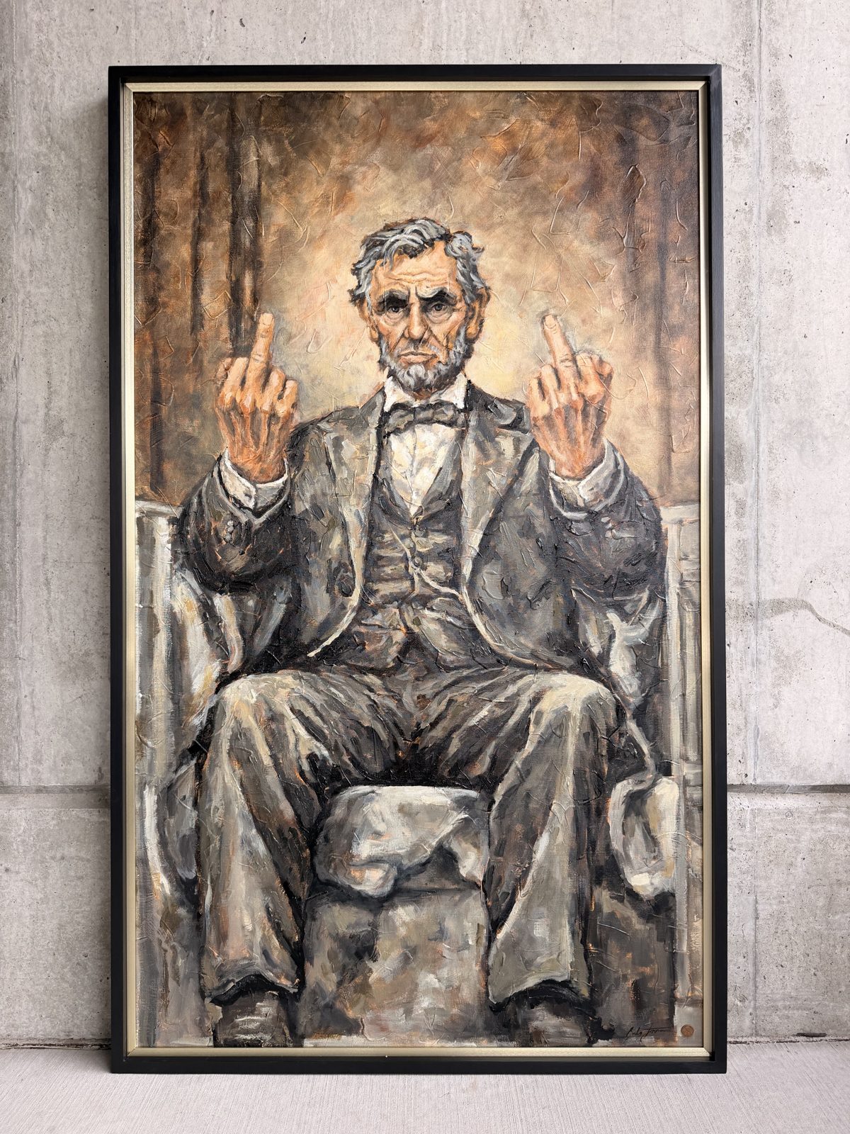 Large painted portrait of Abraham Lincoln seated in his memorial chair in sepia and gold tones, framed in black, leaning against a concrete wall